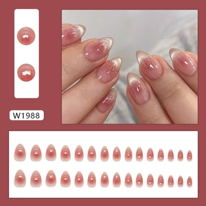 Pink cat eye almond press-on nails with shimmering gradient effect and glossy finish