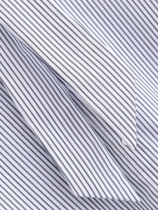 Detail of blue and white striped poplin shirt showing fine woven fabric and tie collar
