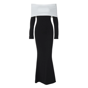 Detail of elegant off-shoulder long-sleeve slim dress in black and white contrast