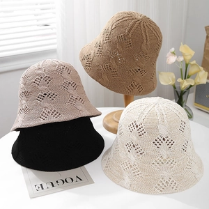 Chic hollow knit bucket hats in white, beige, camel, and black colors for summer
