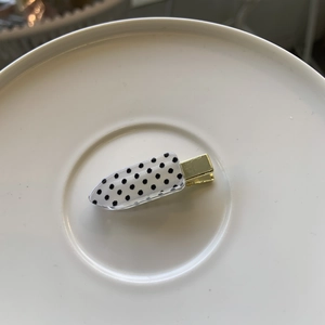 Chic thick polka dot duckbill hair clip with black fabric and clear acrylic finish