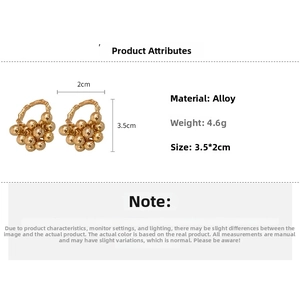 Detailed view of cluster gold ball earrings with dimensions 3.5cm by 2cm and 4.6g weight