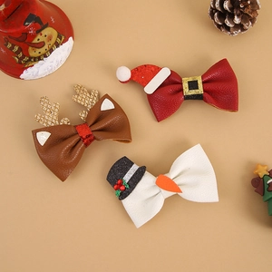 Christmas bow hair clip set with reindeer and Santa motifs on warm beige background