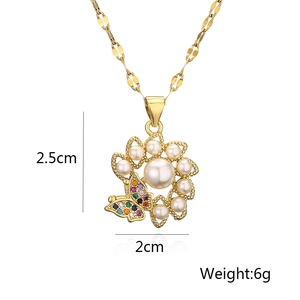 Detail of gold flower and butterfly pendant with pearls, zircon, size 2.5x2cm, weight 6g