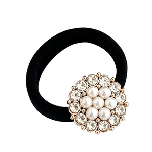 Elastic black hair tie featuring a central pearl and rhinestone butterfly bow decoration
