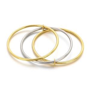 Three-piece set of interlocking 3mm stainless steel bangles in gold and silver finishes