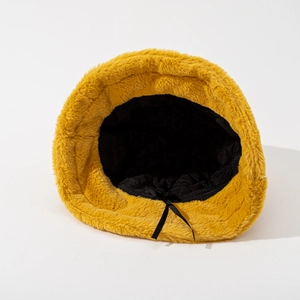 Furry bright yellow plush bucket hat with warm faux fur texture and black quilted lining