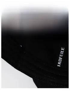 Detail of the moisture-wicking sweatband and stitching inside the black baseball cap