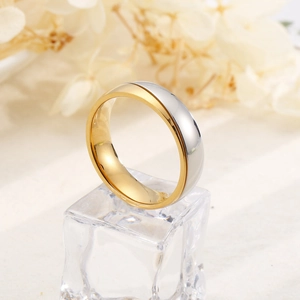 Minimalist two-tone stainless steel couple ring with diamond on a crystal ice prop