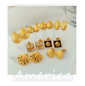 Detailed set of golden shell-inspired earrings with enamel and colorful rhinestones
