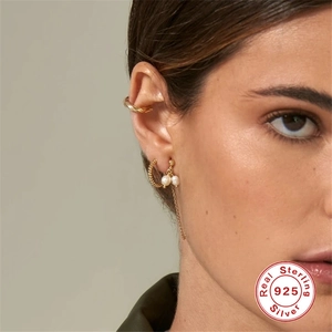 Luxurious S925 sterling silver pearl tassel earrings set worn on model's ear