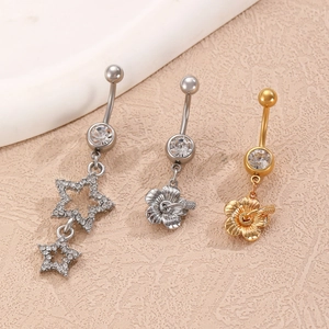 Detailed set of silver stars and hibiscus flower belly rings with zircon inlays