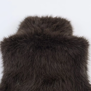 Detailed close-up showing soft texture and long-pile fur of the dark brown faux fur vest