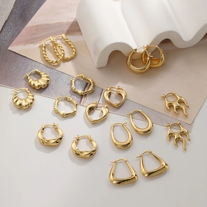 Set of 18K gold-plated geometric earrings including heart, flame, and hoop designs