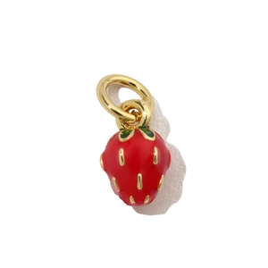 Macro view of strawberry charm with red enamel finish and gold metal details