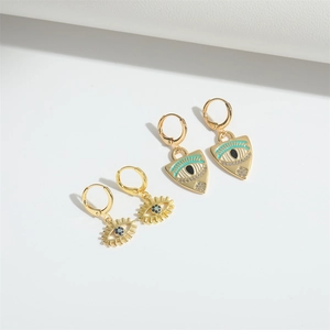 Golden triangle evil eye earrings with blue enamel and sparkling rhinestones