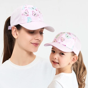 Pink baseball cap with colorful butterfly prints shown on mother and child models