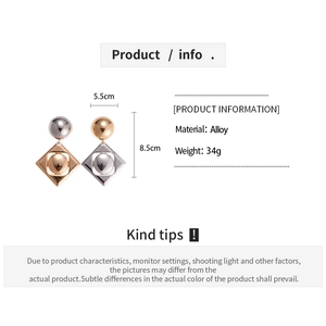 Detailed view of geometric alloy earrings with size specs and gold-silver color blocking