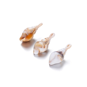 Detailed view of three acrylic conch pendants with brown marble texture for DIY jewelry