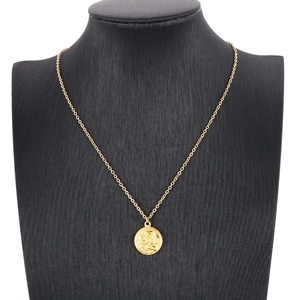 Vintage gold stainless steel round coin necklace featuring relief pendant for women