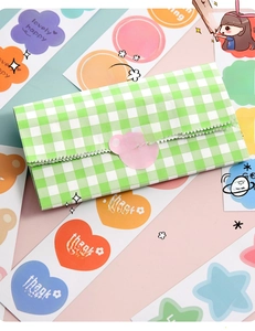 Close-up of cute cartoon puppy round waterproof stickers used for gift sealing and packaging