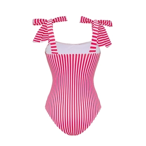 Detail of red and white striped one-piece swimsuit with adjustable shoulder bow straps
