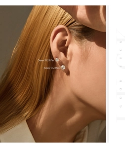 Close-up of S925 silver stud earrings showing 5mm and 6mm sizes comparison on ear