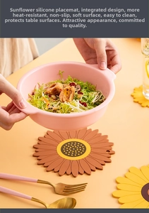 Close-up of sunflower silicone placemat with yellow petals and a pink bowl on top