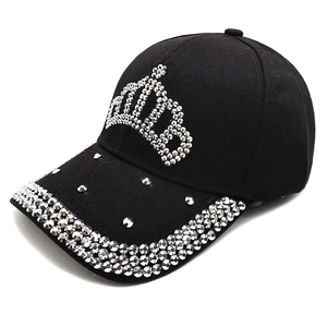 Detailed view of black baseball cap with rhinestone crown and studded brim accents