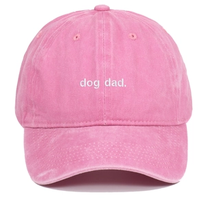 Pink washed cotton baseball cap featuring white Dog Dad embroidery on the front