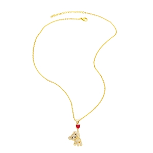 Detail of gold teddy bear pendant with micro-pave zircons and small red heart
