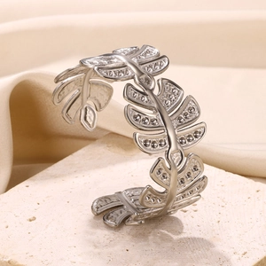 Macro detail of silver leaf bangle featuring shimmering cubic zirconia pavé setting
