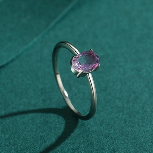 Elegant S925 sterling silver ring with oval watermelon tourmaline gemstone on green surface