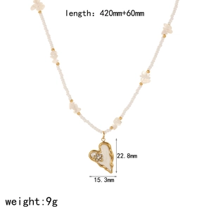 Detail of heart pendant necklace with gold frame, cream enamel and size dimensions