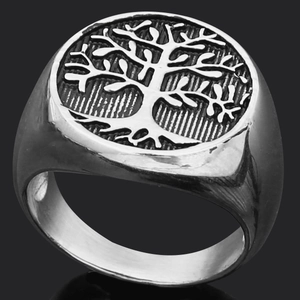 Macro detail of retro Tree of Life relief on a silver stainless steel signet ring band