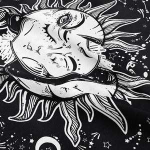 Detailed close-up of woven fabric texture and sun moon astrology print on tapestry