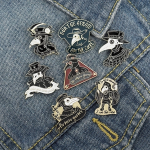 Creative Plague Doctor crow enamel pins set in punk style on denim background