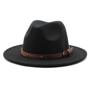 Close-up of black wool fedora with brown leather band featuring metal studs and buckle