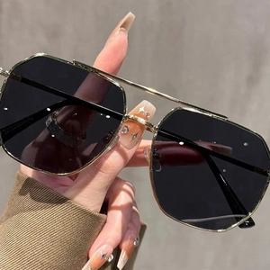 Classic gold metal aviator sunglasses with black large lenses and double bridge design