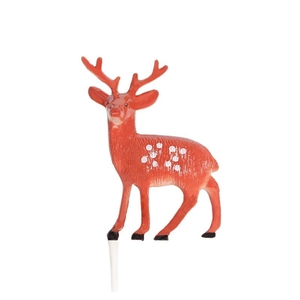 Cute red Christmas reindeer cake topper with white spots and plug on white background