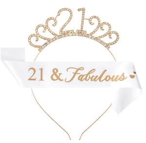 Detail of gold rhinestone tiara with number 21 and 21 & Fabulous white satin sash