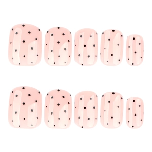 Minimalist short square press-on nails with light pink base and black polka dot pattern