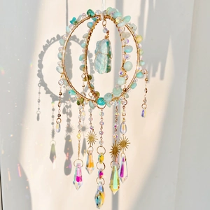 Crystal suncatcher wind chime with light blue beads and sun pendant for wall decor