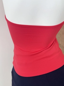 Back view of a red slim-fit cropped tube top in soft elastic knit fabric on a mannequin