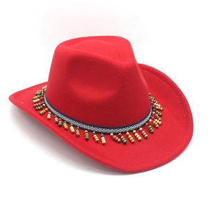 Detail of red fedora hat with ethnic woven band and colorful hanging beads