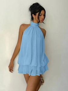 Detail of light blue chiffon halter neck dress featuring layered ruffles and flowing fabric