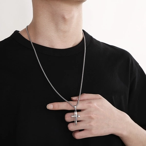 Minimalist silver stainless steel cross pendant necklace with box chain for men worn by model
