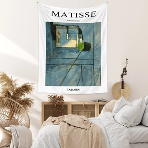 Detail of bohemian Matisse art tapestry with blue abstract design on bedroom wall