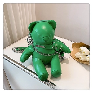 Close-up of a green bear-shaped PU leather crossbody bag with metal chain and collar detail