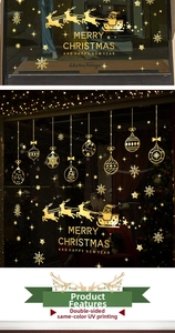 Detail of gold Christmas window decals with UV printing showing Santa and snowflakes